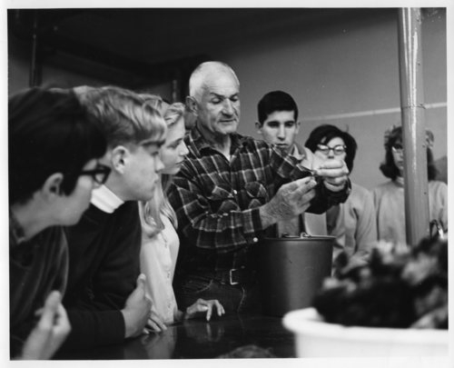 black and white photo of Fred Telonicher with students 